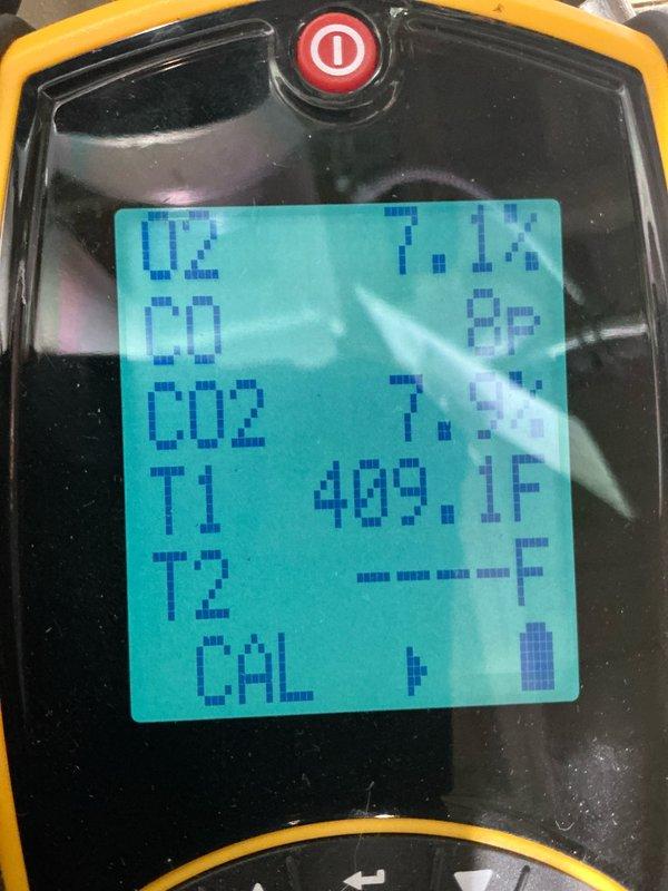 Performed routine maintenance on 10+ year old hydronic boiler. Conducted combustion analysis with digital analyzer showing O2 levels at 21.0% initially and CO2 at 7.1% post-adjustment, with flue gas temperature reaching 409.1°F. System now operating within manufacturer specifications.