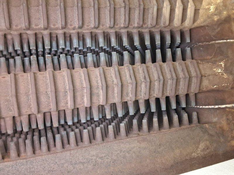 Performed scheduled boiler tune-up service, inspecting heat exchanger components which showed signs of oxidation and dust accumulation on the metal fins. Observed multiple rows of heat transfer elements with some corrosion present but still functional. Service was rescheduled from a previous appointment.