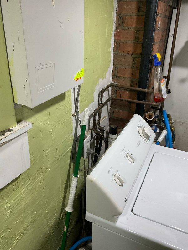 Replaced failed cold water supply line to kitchen. Installed new copper piping with brass fittings and blue-handled shutoff valves along basement joists. System was pressure tested and confirmed operational with no leaks.