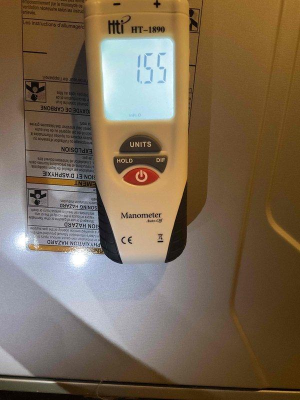 Responded to no heat call for system under 10 years old. Performed pressure testing with manometer (reading 1.55) and temperature diagnostics (ambient reading 63.2°F). Restored heating functionality by adjusting gas pressure to manufacturer specifications and verified proper operation before completion.