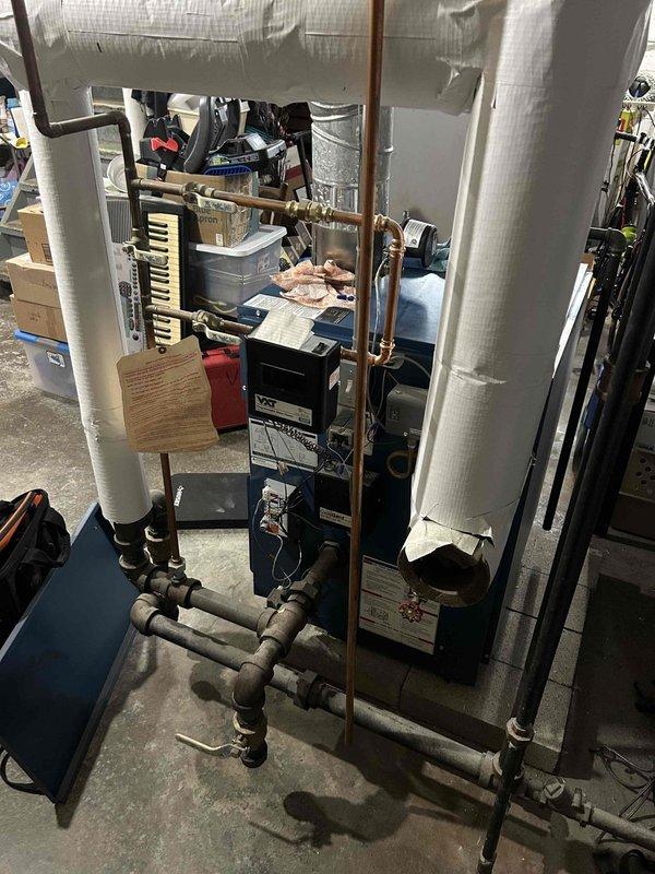 Performed scheduled boiler maintenance service. Inspected copper piping connections and identified significant water damage to structural beam above piping junction. Observed deterioration in ductwork insulation requiring attention during next service interval.