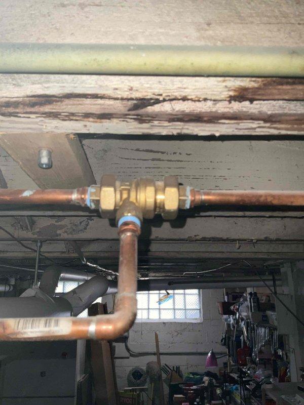 Performed scheduled boiler maintenance service. Inspected copper piping connections and identified significant water damage to structural beam above piping junction. Observed deterioration in ductwork insulation requiring attention during next service interval.