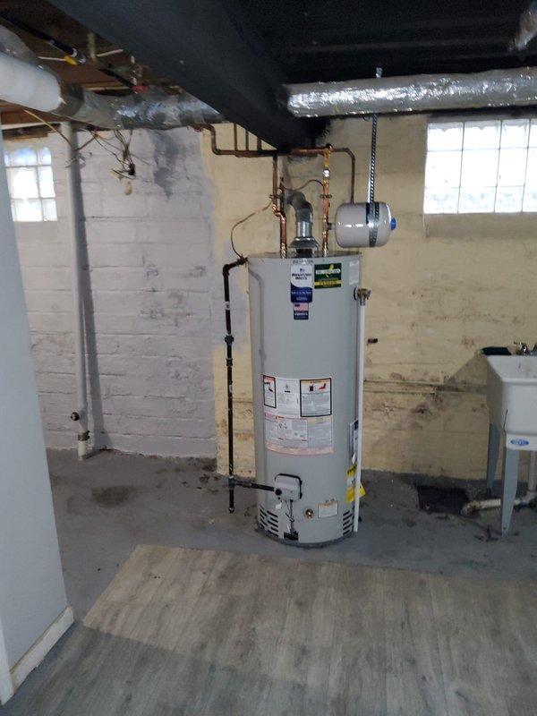 Successfully replaced 50-gallon water heater in basement utility room, including installation of an expansion tank. Accessed wall cavity to service plumbing for his and her sink, addressing copper pipe connections at the brass distribution manifold. Completed all necessary connections to existing ductwork and PVC water lines with proper hot/cold designations.