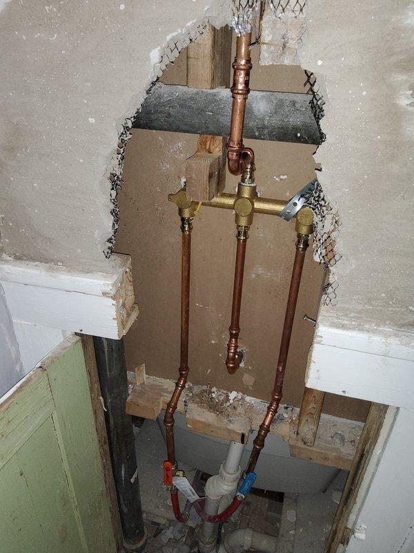 Successfully replaced 50-gallon water heater in basement utility room, including installation of an expansion tank. Accessed wall cavity to service plumbing for his and her sink, addressing copper pipe connections at the brass distribution manifold. Completed all necessary connections to existing ductwork and PVC water lines with proper hot/cold designations.