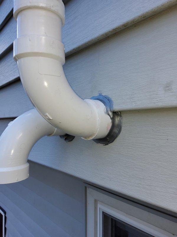 Completed full HVAC system replacement including Bryant condensing unit and new furnace with upgraded venting system. Installed dual 2" PVC flue pipes through garage wall, eliminating existing chimney PVC flue path. Additional work included reusing existing lineset after flushing, replacing return drop, installing Aprilaire filter and Ecobee thermostat, and replacing condensate pump with new tubing.