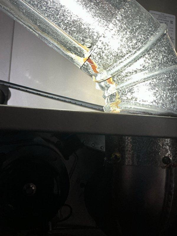 Performed routine tune-up on 7-year-old furnace and inspected exterior AC unit for potential damage caused by fallen gutter as requested. Examination of system components revealed normal wear on the blower wheel assembly and slight condensation on ductwork seams, which were properly sealed with HVAC tape. No significant damage was found on the outdoor condenser unit.