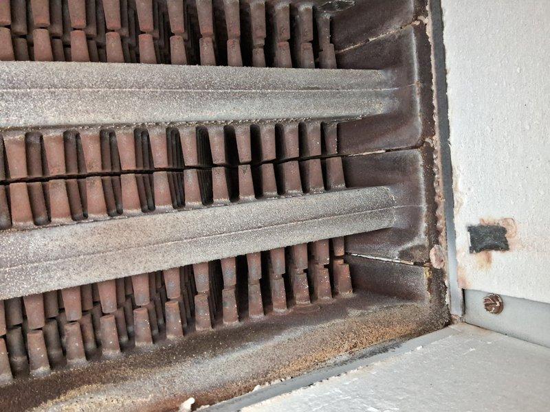 Performed scheduled maintenance on residential boiler and air handler systems. Inspected heat exchanger components which showed significant corrosion on metal fins and deteriorating insulation between plates. Documented condition of heating elements with visible dust accumulation and oxidation on radiator components that will require attention during next service visit.