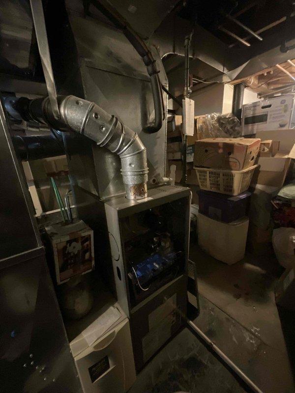 Performed scheduled Home Plan Heating Tune Up on customer's furnace system. Conducted electrical diagnostic testing with multimeter, verifying amperage draw of 5.41A during operation. Inspected furnace components and ductwork connections, confirming proper installation and function of the heating system.