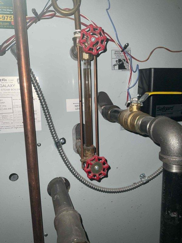 Performed scheduled furnace tune-up service. Inspected boiler system components including sight glass, valves, and copper supply lines. Verified proper operation of Safgard system and checked all plumbing connections in utility area for leaks. System functioning properly with no issues identified.