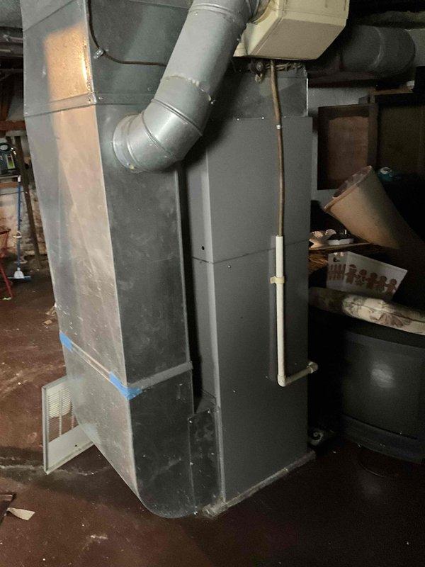 Conducted furnace replacement estimate in residential basement. Inspected existing aging unit and associated ductwork connections. Customer is pursuing grant assistance for replacement costs and scheduled follow-up appointment to proceed with installation.
