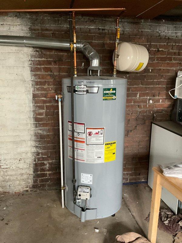Responded to service call for 3-year-old A.O. Smith ProLine commercial grade water heater not delivering hot water to units #2 and #4. Diagnosed system issues in basement (code 6041) and performed necessary adjustments to restore proper hot water flow to affected units. Verified proper ventilation and expansion tank functionality during service.