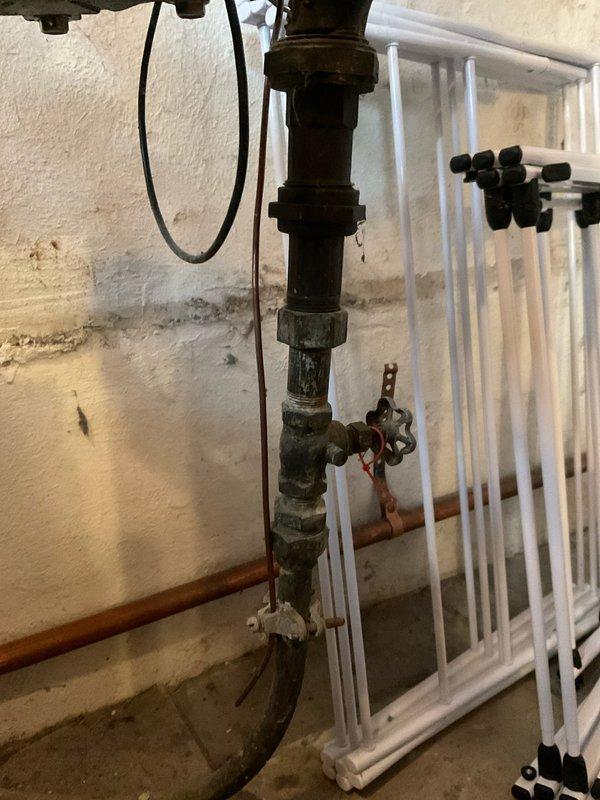 Performed deliming service on 7-year-old tankless water heater to remove mineral buildup and restore optimal performance. Inspected existing plumbing components including valves, copper piping, and connections for proper operation. Scheduled additional maintenance for steam boiler system with technician.
