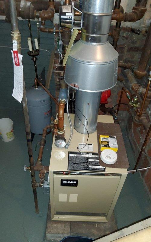 Responded to no-heat call for Weil-McLain boiler system. Diagnosed failed ignition control module causing system failure. Replaced control module, tested all safety components, and verified proper operation. System now functioning with normal flame pattern and appropriate temperature rise.