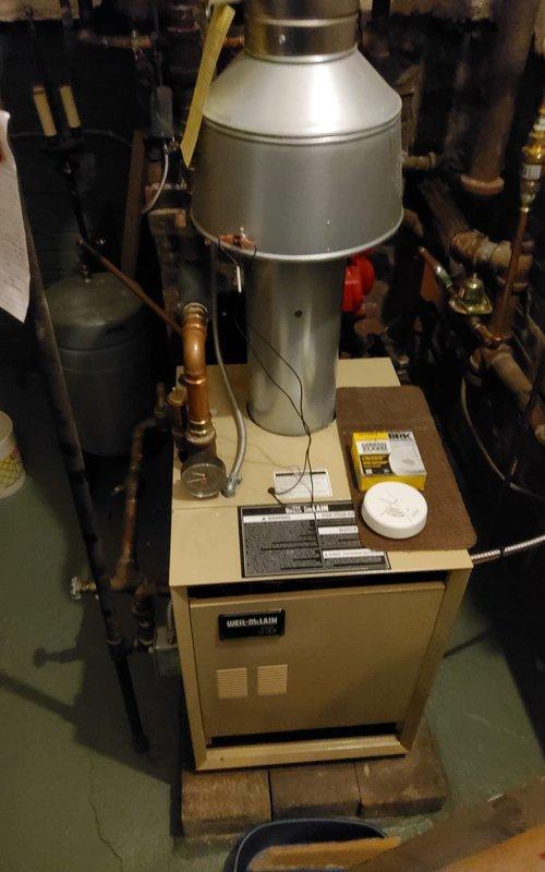 Responded to no-heat call for Weil-McLain boiler system. Diagnosed failed ignition control module causing system failure. Replaced control module, tested all safety components, and verified proper operation. System now functioning with normal flame pattern and appropriate temperature rise.