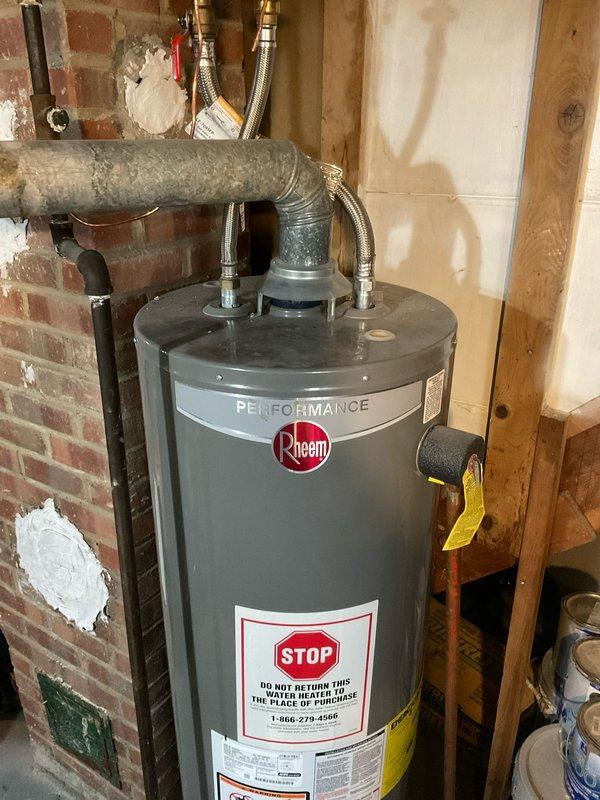 Performed scheduled maintenance on 4-year-old furnace utilizing manufacturer-recommended tune-up procedures. Inspected Honeywell control module, verified proper wiring connections to all components, and checked system operation. Also examined adjacent Rheem Performance water heater installation for proper venting and connection integrity.