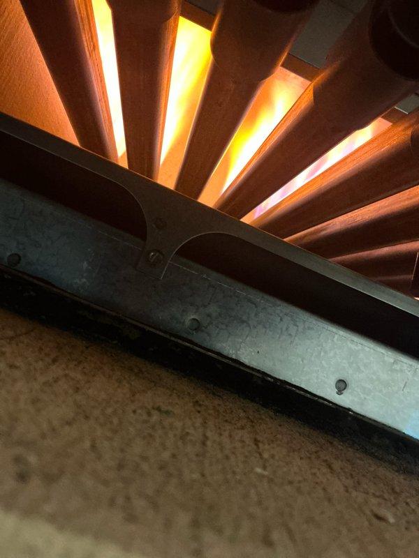 Performed routine maintenance on 7-year-old steam boiler system. Inspected heat exchanger fins for proper operation, noting some age-related discoloration but no significant deterioration. System is functioning within normal parameters after service completion.