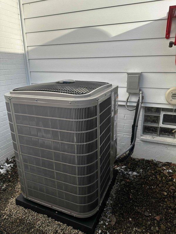 Successfully installed complete HVAC system including new furnace with high airflow base, coil, condenser, and thermostat while integrating existing air cleaner, humidifier, and refrigerant lines. System was properly connected to existing 2" PVC venting and verified operational with pressure testing showing 3.48 inH₂O on manometer measurement.