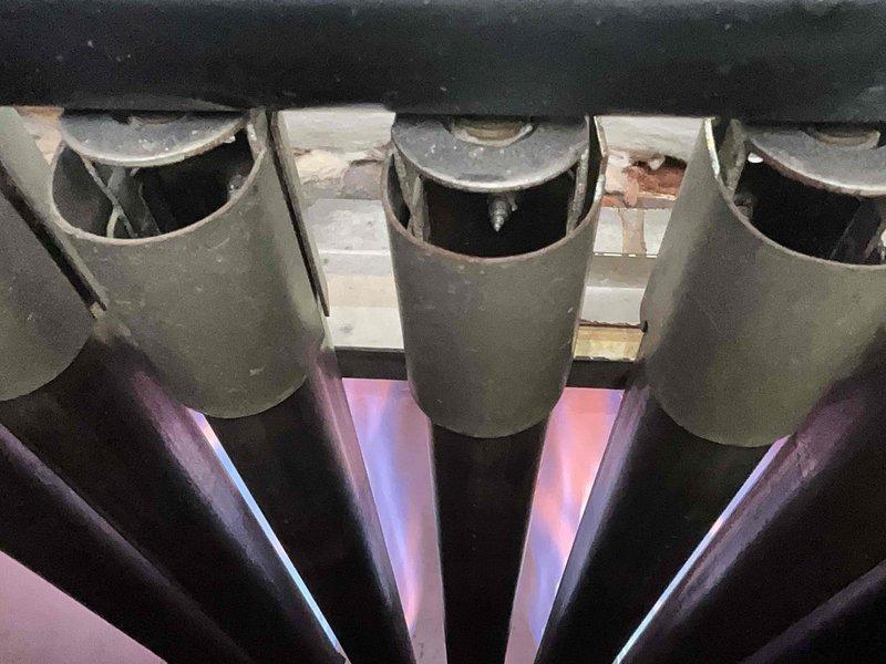 Performed scheduled furnace maintenance on heating system with rescheduled appointment. Conducted combustion analysis with readings of O2 21.8%, CO 0, CO2 0.00%, and temperature at 105.7°F. Confirmed proper burner operation with normal flame pattern and no safety concerns.
