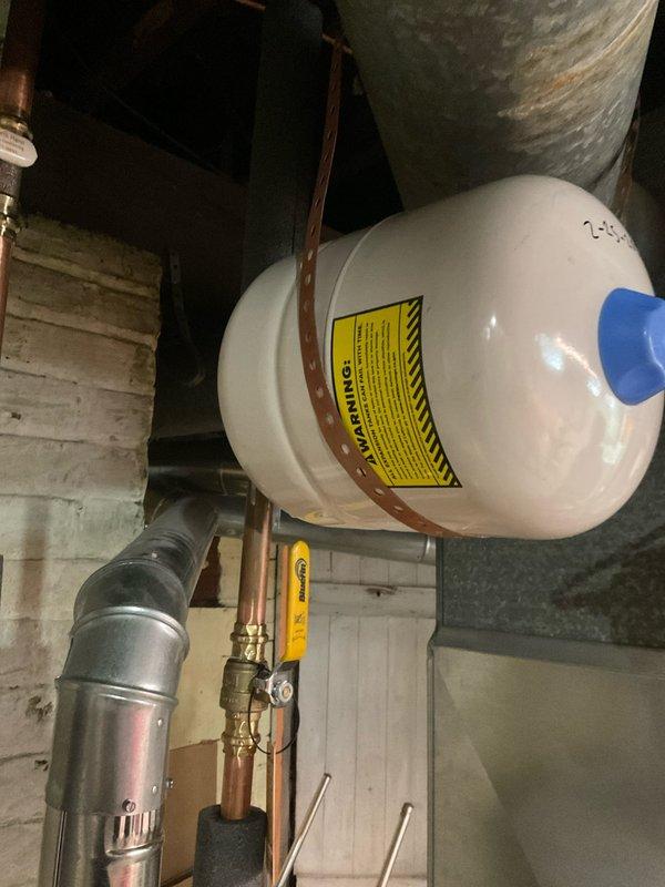 Successfully completed installation of new hot water tank in customer's utility area. Installed expansion tank with proper copper piping connections and verified all components were functioning correctly. System was tested and confirmed to be operating at proper pressure with no leaks.