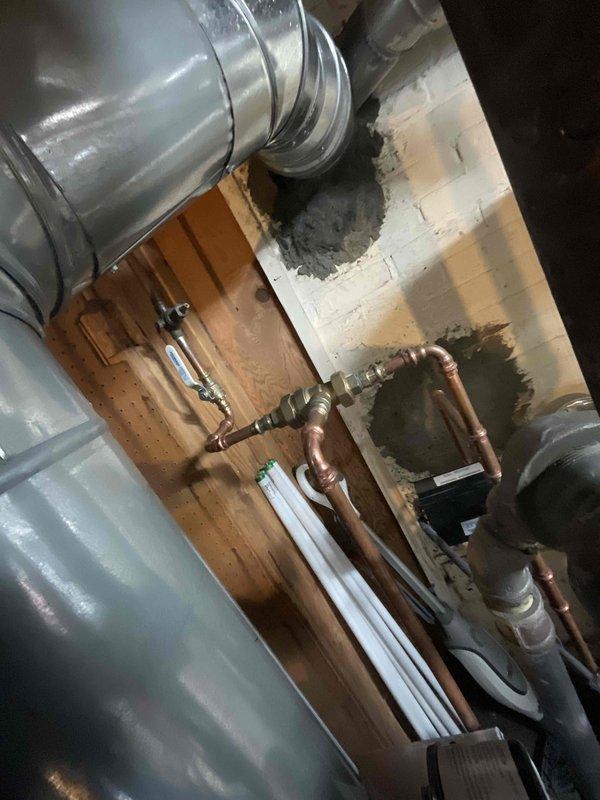 Completed biannual heating maintenance service on dual HVAC systems. Performed comprehensive inspection of ductwork, copper supply lines, and ventilation components in utility area. Conducted electrical testing with Fieldpiece SC680 clamp meter, verifying proper amperage readings of 32.3 on system components to ensure optimal performance for heating season.