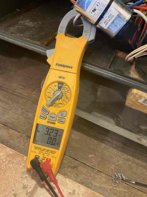 Completed biannual heating maintenance service on dual HVAC systems. Performed comprehensive inspection of ductwork, copper supply lines, and ventilation components in utility area. Conducted electrical testing with Fieldpiece SC680 clamp meter, verifying proper amperage readings of 32.3 on system components to ensure optimal performance for heating season.