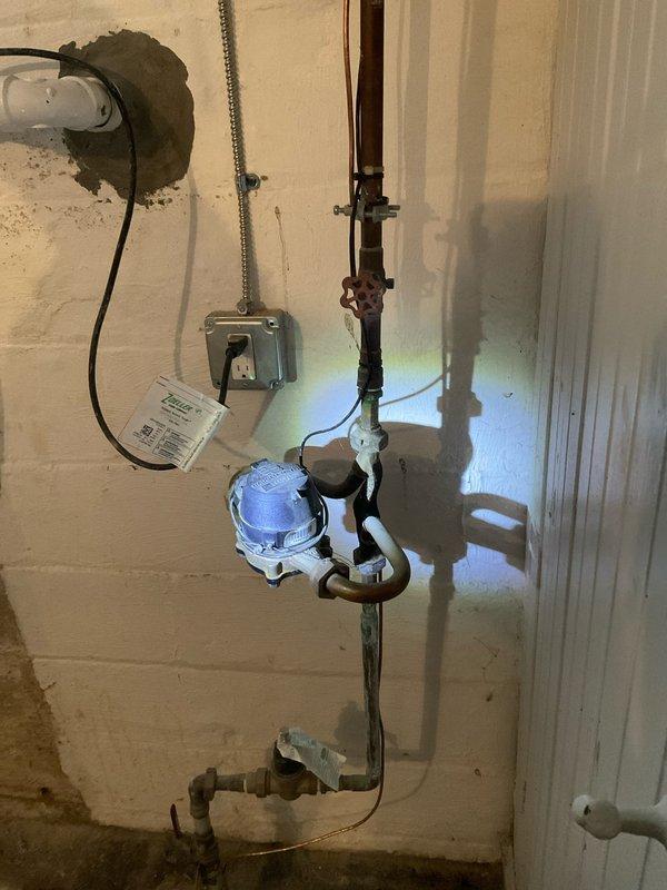 Completed routine maintenance flush of 50-gallon tanked water heater. Inspected pressure regulator valve, copper supply lines, and drain valve during service. Documented condition of plumbing connections and electrical components with photos for service records.