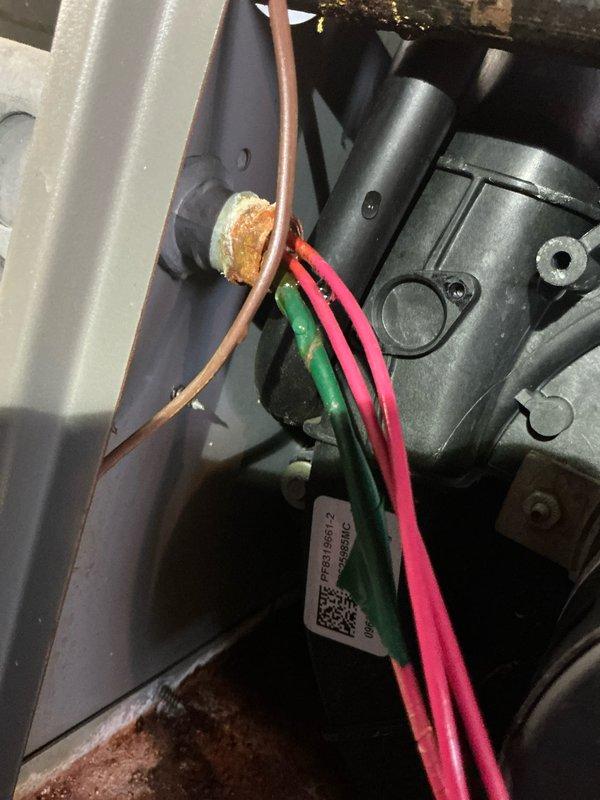 Performed routine maintenance on 12-year-old natural gas furnace. Inspected electrical connections and noted minor oxidation on terminal connections. Verified proper burner operation with clean blue flame pattern indicating complete combustion.