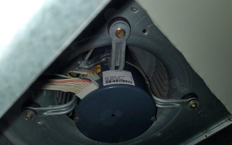 Performed scheduled maintenance service on dual-system heating equipment (heat pump and gas furnace) as part of MVP maintenance program. Inspected blower wheel assembly which showed normal dust accumulation consistent with regular operation. Examined motor assembly and electrical connections, confirming proper mounting and wiring configuration with no visible issues detected.