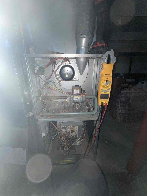 Performed comprehensive heating tune-up on residential furnace system. Conducted electrical diagnostics using Fieldpiece clamp meter to verify proper voltage/amperage at control boards and blower assembly. Measured supply air temperature (61.5°F) with ThermPro digital thermometer, indicating system is operating within normal parameters.