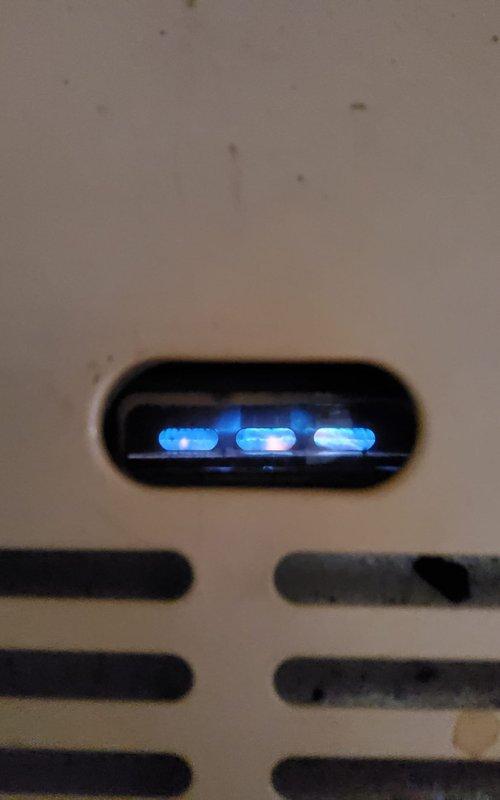 Responded to no-heat call for garage heating system. Diagnostic inspection revealed functioning control board with normal blue LED indicator lights. Confirmed proper operation of exterior wall vent with no obstruction. System restored to normal operation after cleaning and adjustment.