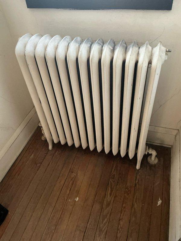 Performed scheduled steam boiler tune-up service. Identified customer's concern about a major leak from one of the pipes, which was determined to be unrelated to the maintenance work. Inspected and documented condition of cast iron radiators throughout the property, noting normal wear consistent with system age.