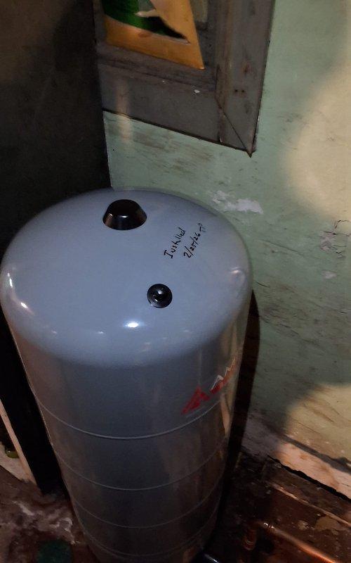 Replaced faulty expansion tank on boiler system and verified proper operating pressure after firing. System now operating within normal parameters with new expansion tank successfully installed and pressure stabilized.