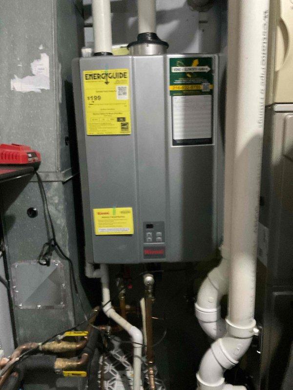 Performed scheduled maintenance on wall-mounted tankless water heater. Inspected all connections, verified proper venting of PVC exhaust system, and checked copper supply lines for integrity. Unit is functioning correctly with no signs of leaks or operational issues.