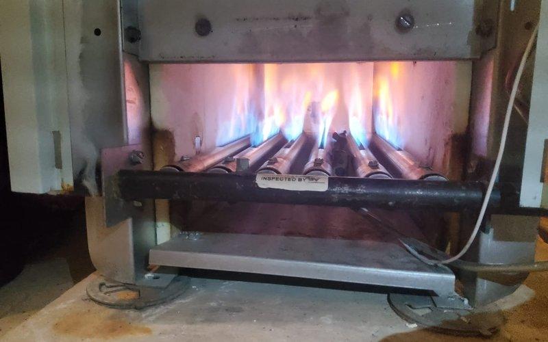 Performed scheduled maintenance on steam boiler system. Inspected heat exchanger fins which showed signs of discoloration and minor corrosion buildup. Verified proper burner operation with good flame pattern and color indicating efficient combustion.