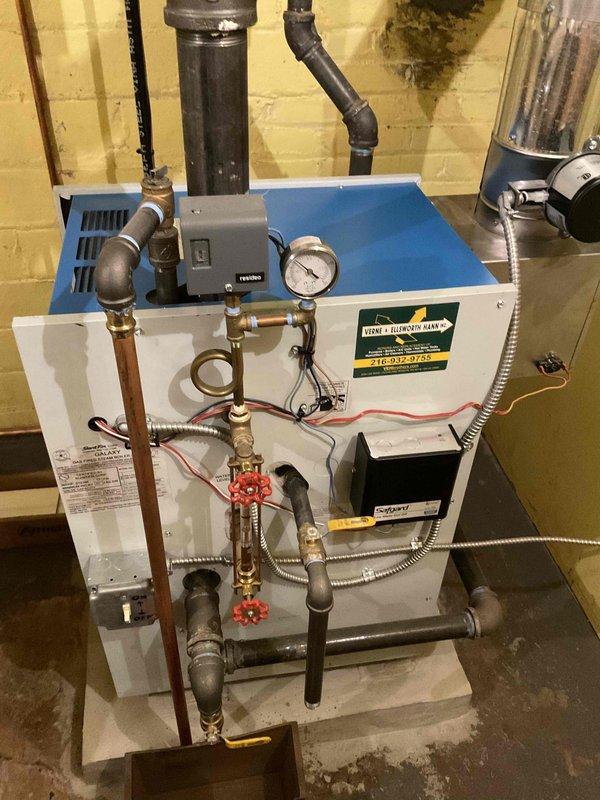 Performed tune-up maintenance service on two heating systems: a furnace with Silent Pilot control board and a boiler system with associated plumbing. Visual inspection of both units confirmed proper installation of components including wiring, gas valve assembly, heat exchanger, pressure gauge, and various piping connections.