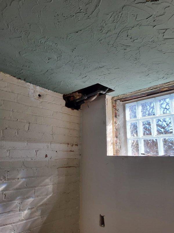 Successfully rerouted steam radiator return line adjacent to basement window, ensuring proper system flow while maintaining clearance from the window opening. Installation included proper insulation of all exposed ducts and securing connections to existing HVAC infrastructure.