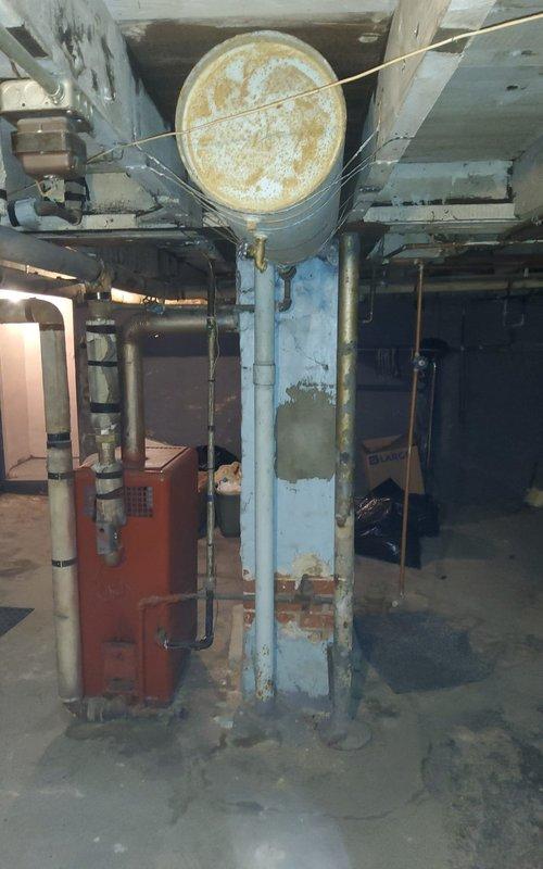 Diagnosed 40-50 year old American Standard hot water heating system that was overheating the residence and emitting burning odors during operation. Inspection revealed the aging boiler system is no longer responding properly to thermostat commands. Recommended replacement of the antiquated system due to age, condition, and safety concerns.