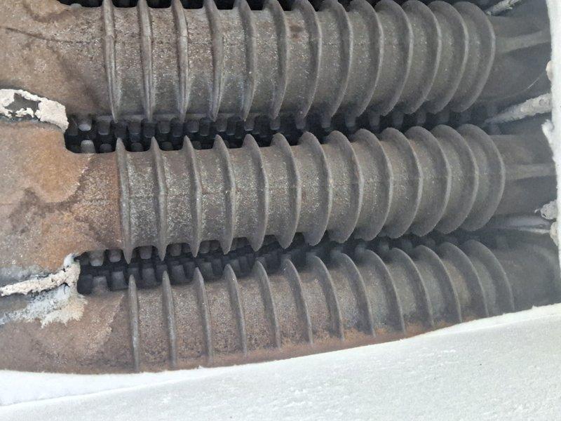 Performed scheduled maintenance on steam boiler system. Inspected heat exchanger coils which showed moderate dust accumulation and scale buildup. Identified and repaired water leak as reported by customer.