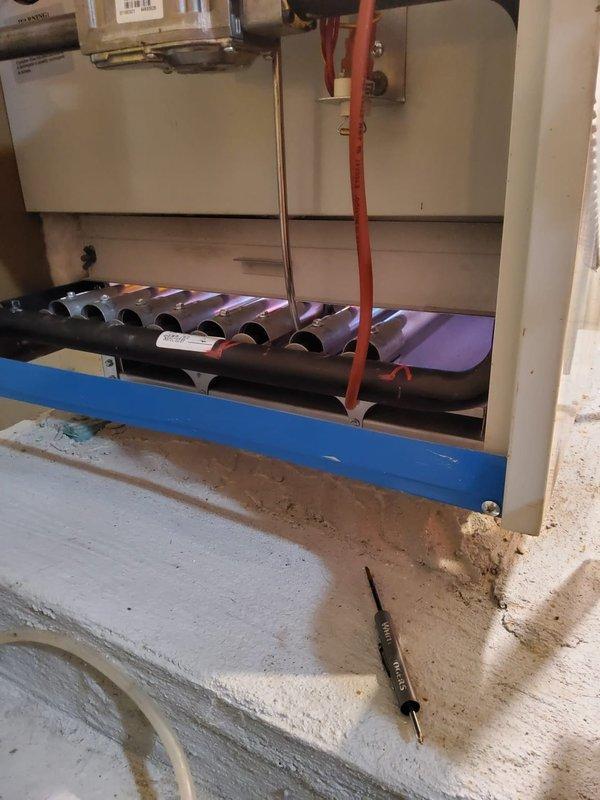 Performed scheduled maintenance on residential boiler system. Inspected burner assembly and found significant rust/oxidation on heat exchanger fins. Completed standard cleaning and operational testing to ensure proper functionality despite visible wear on components.