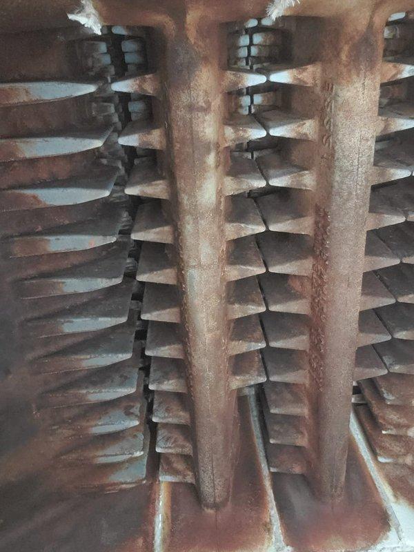 Performed scheduled maintenance on residential boiler system. Inspected burner assembly and found significant rust/oxidation on heat exchanger fins. Completed standard cleaning and operational testing to ensure proper functionality despite visible wear on components.