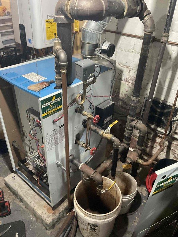 Performed scheduled maintenance on 8-year-old MVP steam boiler system. Inspected copper piping and T-junction valve assembly for proper operation. Evaluated main boiler unit, checked control panels, and examined all connection points; placed collection buckets to capture minor condensation during service.