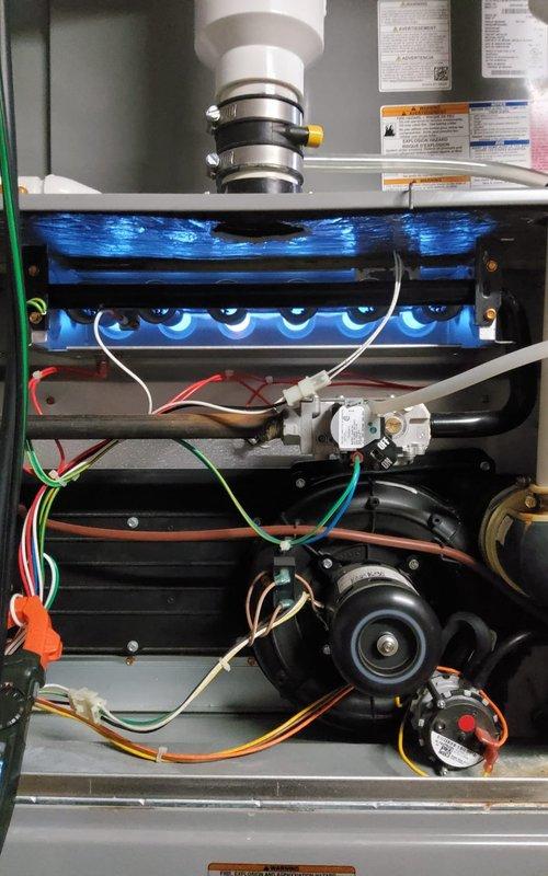 Performed scheduled maintenance on two heating systems. Inspected furnace components including heat exchanger, burner assembly, gas valve, and blower motor, with all connections and wiring verified. Conducted combustion analysis testing showing proper operation with O2 at 13.7% and CO2 at 4.1%, confirming system efficiency and safe operation.