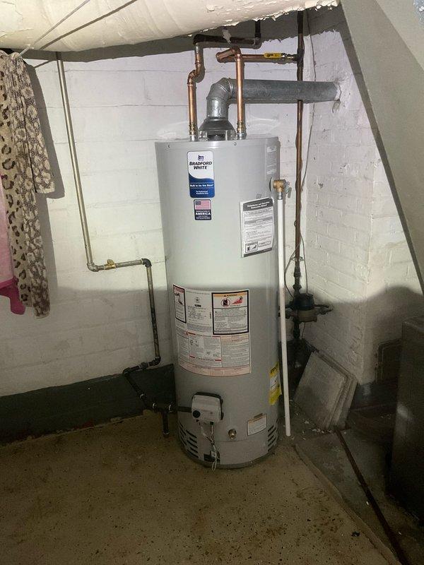Successfully installed a new 40-gallon tall water heater with proper gas connections and shut-off valve. Completed all required plumbing work including copper pipe connections, venting, and verified proper functionality of the Bradford White unit.