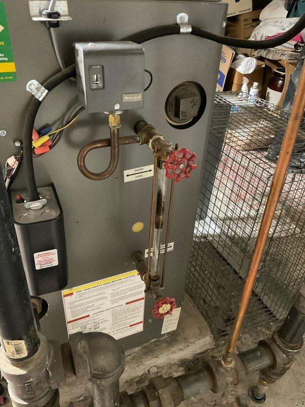 Completed annual boiler maintenance on residential heating system. Inspected all components including pressure controls, valves, and exhaust connections for proper operation. System is functioning within normal parameters; customer advised of home plan renewal options for continued service coverage.