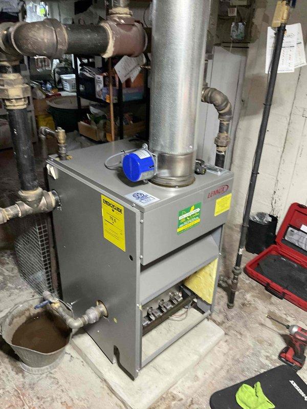 Completed annual boiler maintenance on residential heating system. Inspected all components including pressure controls, valves, and exhaust connections for proper operation. System is functioning within normal parameters; customer advised of home plan renewal options for continued service coverage.