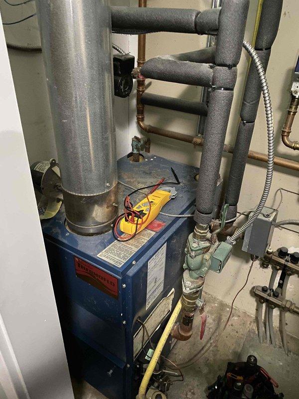 Diagnosed and repaired 15-year-old non-operational boiler system using multimeter testing to identify electrical fault in control panel. Restored proper functionality by replacing damaged wiring connections and recalibrating thermostat settings, successfully returning heat to residence.