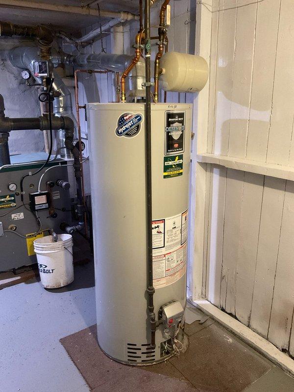 Diagnosed and serviced an inoperative traditional tank water heater in century home. Inspected Honeywell control valve which showed signs of wear but remained functional. System was restored to proper operation with temperature settings adjusted appropriately for the older residential plumbing infrastructure.