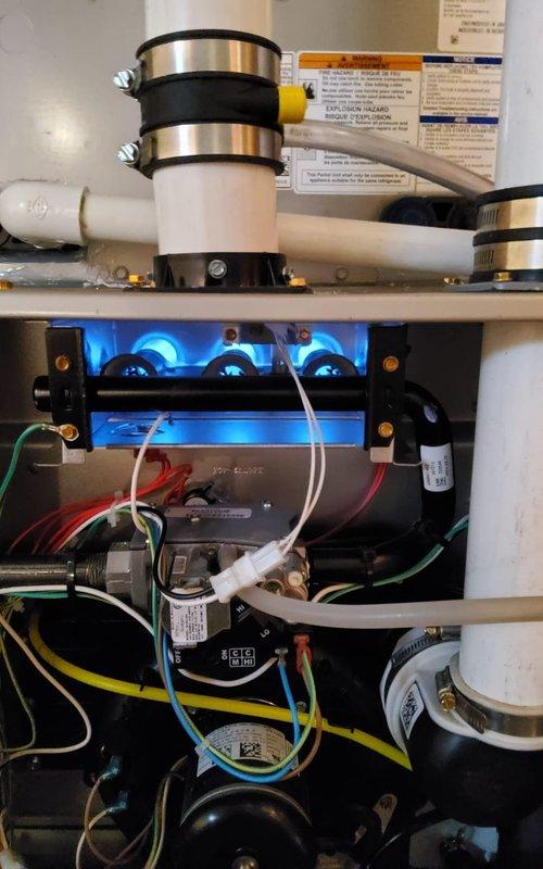 Performed scheduled maintenance on residential heating system. Inspected furnace components and verified proper combustion with blue flame indication. System is operating correctly with all connections secure and ventilation functioning as designed.