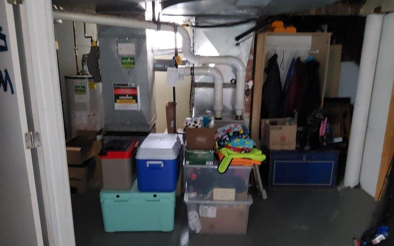 Performed Home Plan Heating Tune Up on residential HVAC system. Inspected and replaced pleated air filter which showed moderate dust accumulation. Conducted visual inspection of furnace unit and surrounding ventilation components in basement utility area.