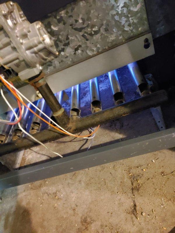 Performed routine boiler maintenance as part of scheduled home plan service. Inspected burner assembly showing proper flame pattern with good blue coloration, indicating efficient combustion. Examined heat exchanger for signs of corrosion and verified proper operation of gas valve and electrical connections.